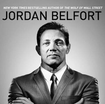 Black-and-white book-style portrait of a suited man with arms crossed, bold all-caps headline at top, gray background