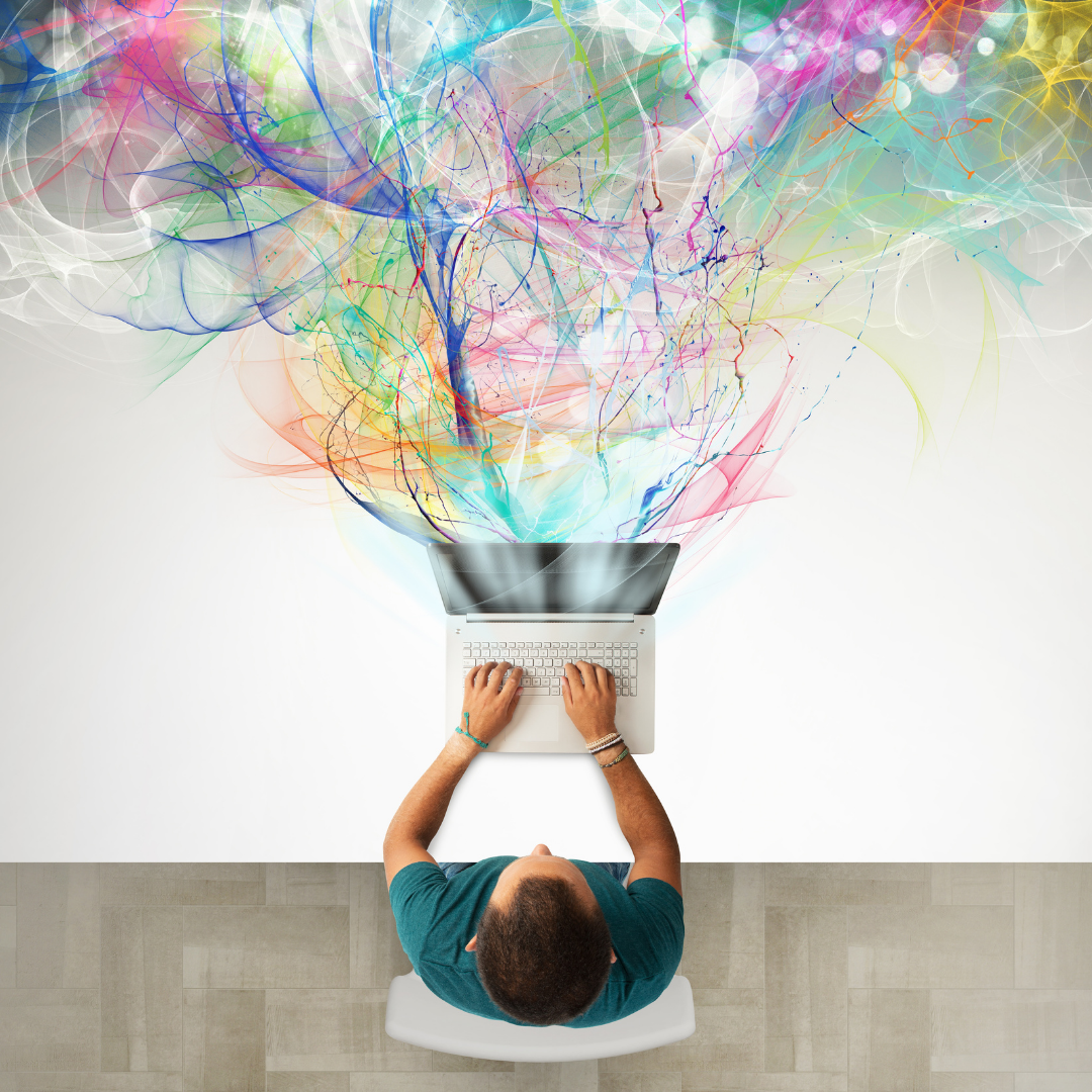 Person typing on a laptop with colorful abstract swirls flowing from the screen to represent creativity