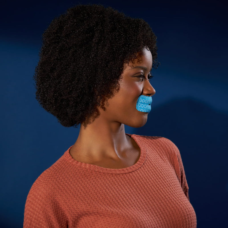 Applying the tape over closed lips